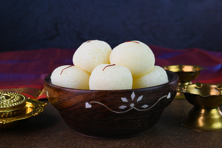 Rasgulla is an Indian dessert served in a wooden bowl.の写真素材