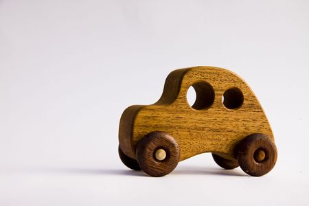 Retro wooden toy car over white backgroundの写真素材