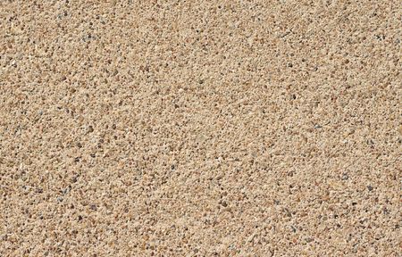 A seamless rough pebble concrete footpath or sidewalk backgroundの写真素材