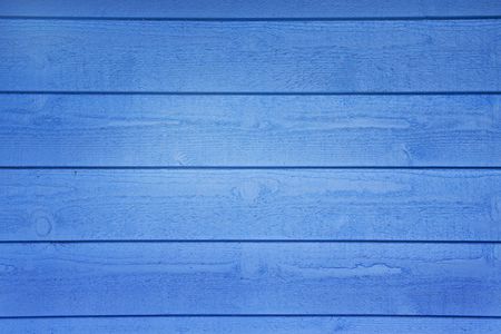A blue wooden wall with horizontal planksの写真素材