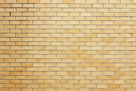 A background image of an orage brickwallの写真素材