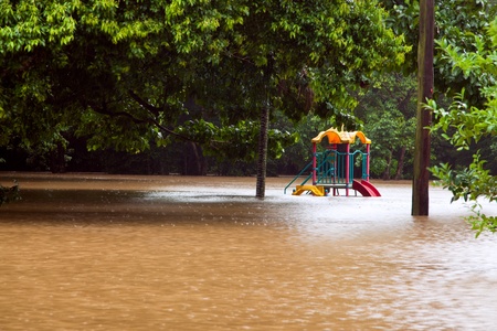 Childrens playground under water after heavy rain and flooding in Queensland Australiaの写真素材