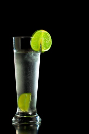 Fresh cold drink with freshly cut limeの写真素材