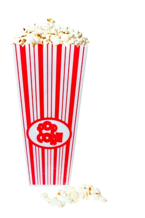 Popcorn tub overflowing with fresh delicious popcorn. Isolated on whiteの写真素材