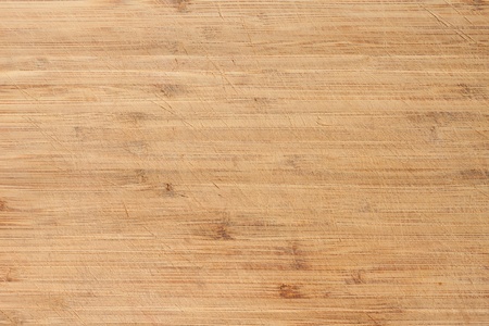 Old worn and scratched cutting board. Perfect background or texture.の写真素材