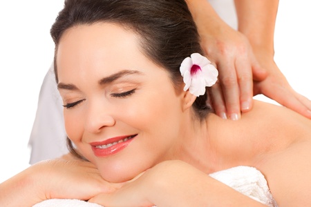 Closeup of a beautiful young woman  enjoying a massage.の写真素材