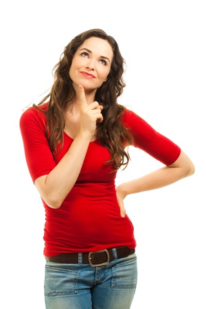 A beautiful young woman wearing a christmas red top and looking contemplative. Isolated over white.の写真素材