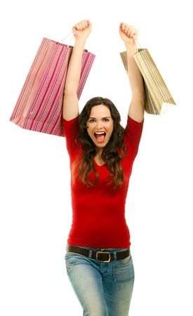 Beautiful young woman very happy with her Christmas shoppingの写真素材