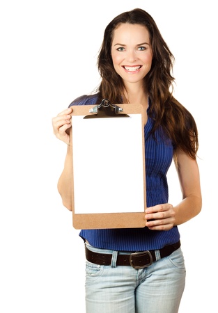 Beautiful young woman smiling and holding up a blank clipboardの写真素材