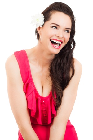 A beautiful sexy young woman in a red dress laughingの写真素材