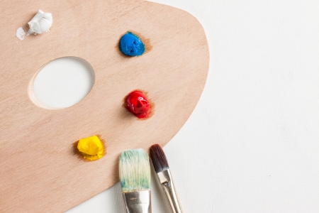Oil paint and paint brushes on a palletteの写真素材