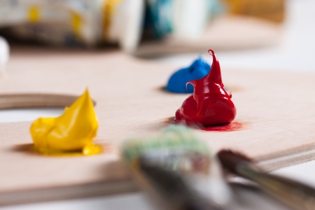 Oil paint and paint brushes on a palletteの写真素材
