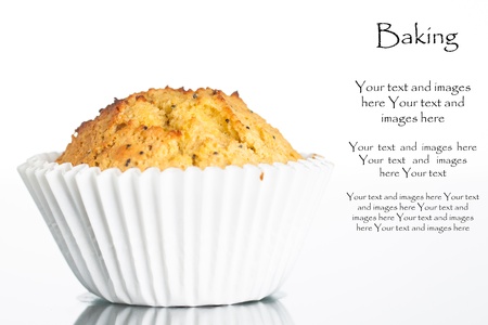 Close-up of a freshly home baked banana muffin with poppy seeds  Isolated on white の写真素材