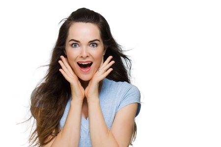 Happy surprised beautiful woman looking at camera. Isolated on white.の写真素材