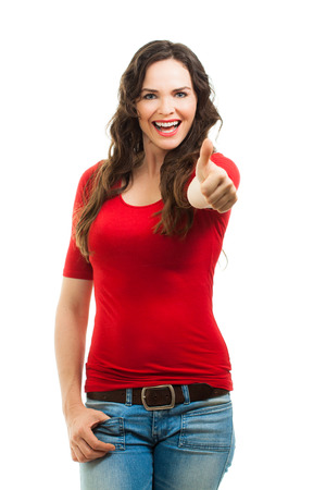 A happy positive beautiful young woman giving thums up  Isolated on white の写真素材