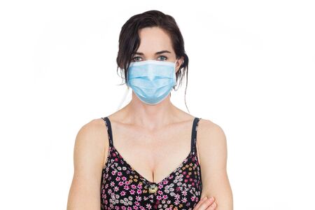 Woman wearing protective face mask to protect against virus infection. Isolated on white.の写真素材