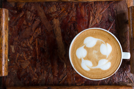 Cup of coffee hot on wooden table.の写真素材