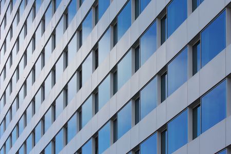 reflect of the sky on building's windowsの写真素材