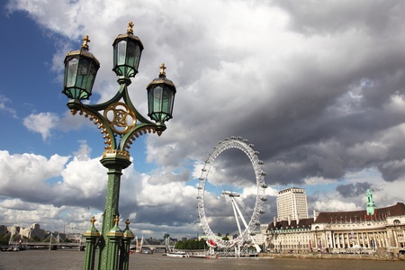 London, United Kingdom - July 27, 2009: View on the London Eye along the bank of the Thames River in London England which is the tallest ferris wheel in Europe. It is a very popular tourist attraction. のeditorial素材