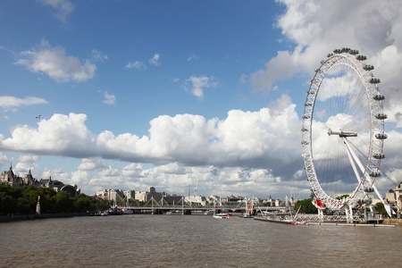London, United Kingdom - July 27, 2009: View on the London Eye along the bank of the Thames River in London England which is the tallest ferris wheel in Europe. It is a very popular tourist attraction. のeditorial素材