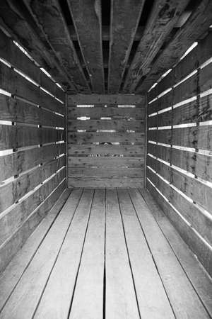 wooden animal transport box inside black and white backgroundの写真素材