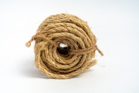 Coil of fiber rope sisal small on isolated white backgroundの写真素材