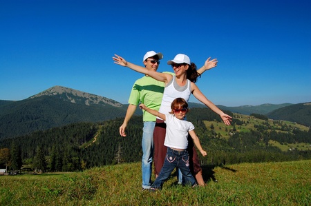 Family of three having fun outdoorsの写真素材