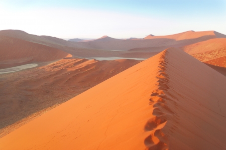 Beautiful sunrise dunes, lake and nature of Namib desert, Sossusvlei, Namibia, South Africaの写真素材