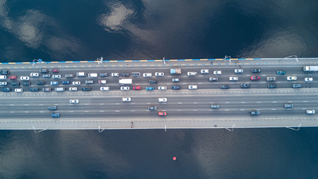 Aerial top view of bridge road automobile traffic of many cars, transportation concept