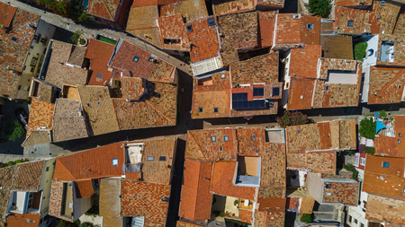Aerial top view of residential area houses roofs and streets from above, medieval town backgroundの写真素材
