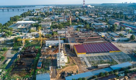 Aerial top view of industrial park zone from above, factory chimneys and warehouses, industry...