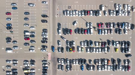Parking lot with many cars aerial top drone view from above, city transportation and urban conceptの写真素材