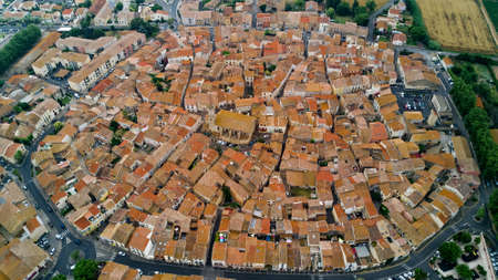 Aerial top view of residential area houses roofs and streets from above, old medieval town background, Franceの写真素材