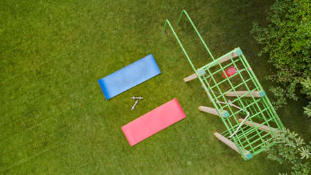Sports ground and equipment in park aerial top view from above, street fitness, sport and active...