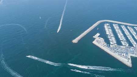 Aerial top view of boats and yachts in modern marina from above, Mediterranean sea, South France