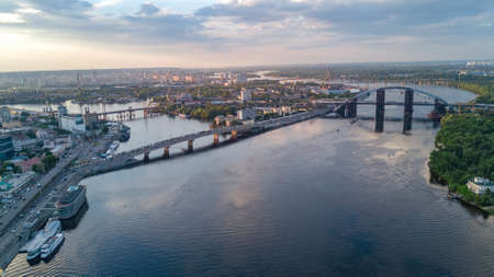 Aerial drone view of Dnepr river and Rybalskiy island from above, bridges and skyline of Kiev city, Ukraineのeditorial素材