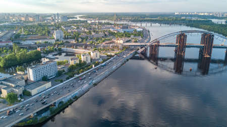 Aerial drone view of Dnepr river and Rybalskiy island from above, bridges and skyline of Kiev city, Ukraineのeditorial素材