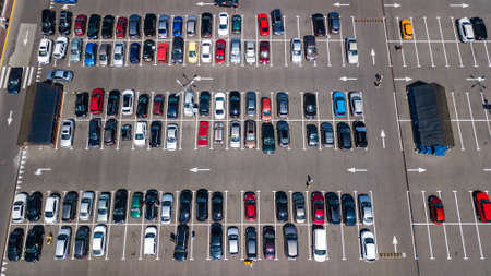 Aerial drone view of parking lot with many cars from above, city transportation and urban conceptのeditorial素材