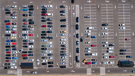 Aerial drone view of parking lot with many cars from above, city transportation and urban conceptのeditorial素材