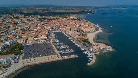 Aerial top view of boats and yachts in marina from above, harbor of Meze town, South Franceのeditorial素材