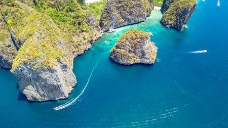 Aerial drone view of tropical Ko Phi Phi island, beaches and boats in blue clear Andaman sea water from above, beautiful archipelago islands of Krabi, Thailandの写真素材