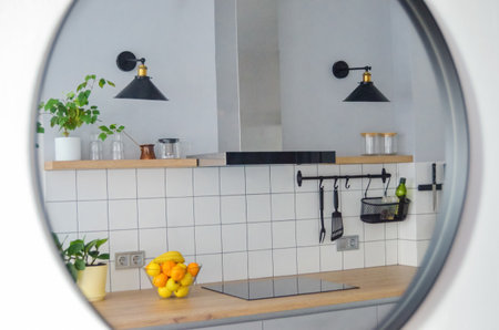 Modern stylish Scandinavian kitchen interior with kitchen accessories. Bright white and gray kitchen...