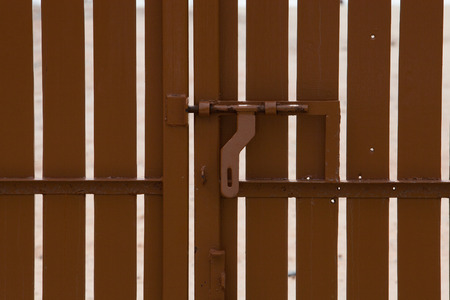 wooden gate closed position with sea backgroundの写真素材