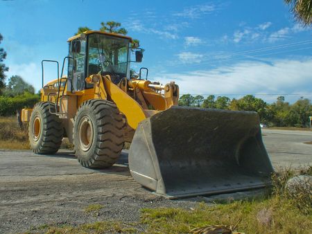 Construction Equipment Standing Idle on Building Site