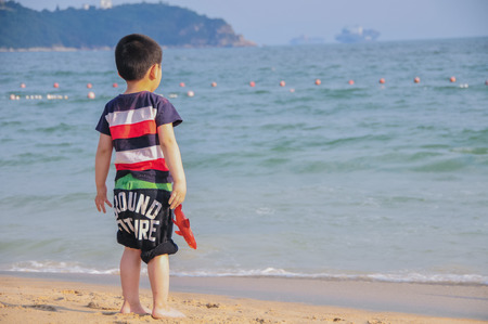 Children playing at the beachの写真素材