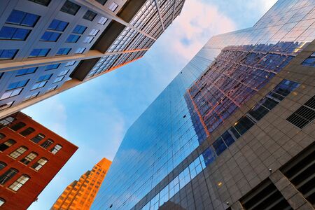 Boston Skyline Showing Financial District at Sunrise. The Financial District of Boston is located in...