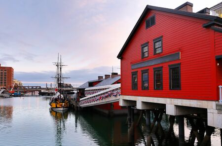 Boston Harbor at sunrise viewing from Fan Pier Park. Boston Harbor is a natural harbor and estuary of Massachusetts Bay,の写真素材