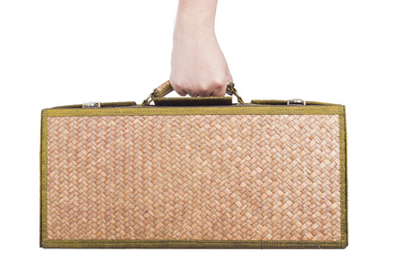 holding wooden luggage rattan isolated on whitel background.の写真素材
