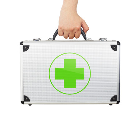 Male hand holding equipments luggage first aid isolated white background.の写真素材