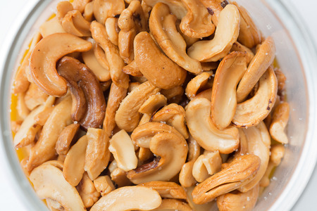 Close-up Cashews with salt in a small pot.の写真素材